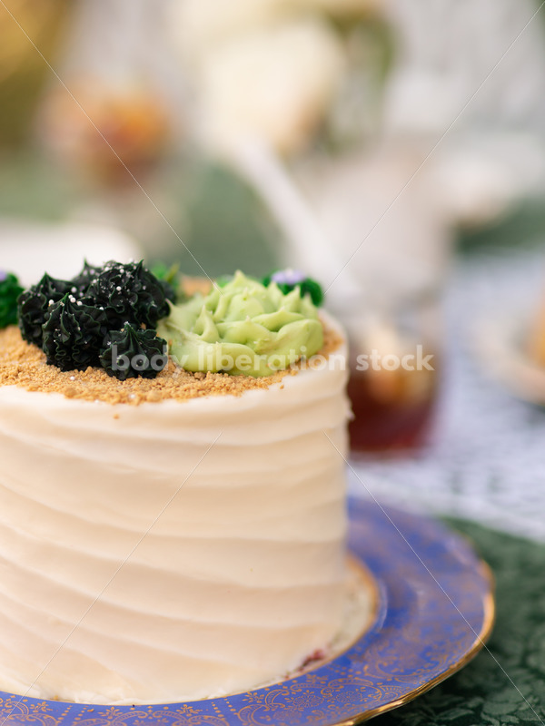 Close-up of Decorated Cake on Tea Party Table - Body Liberation Photos