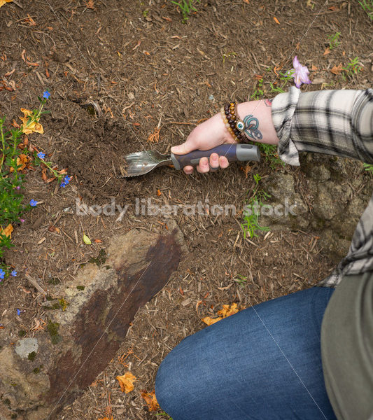 Diverse Gardening Stock Photo: Agender Person Digs with Trowel - Body Liberation Photos