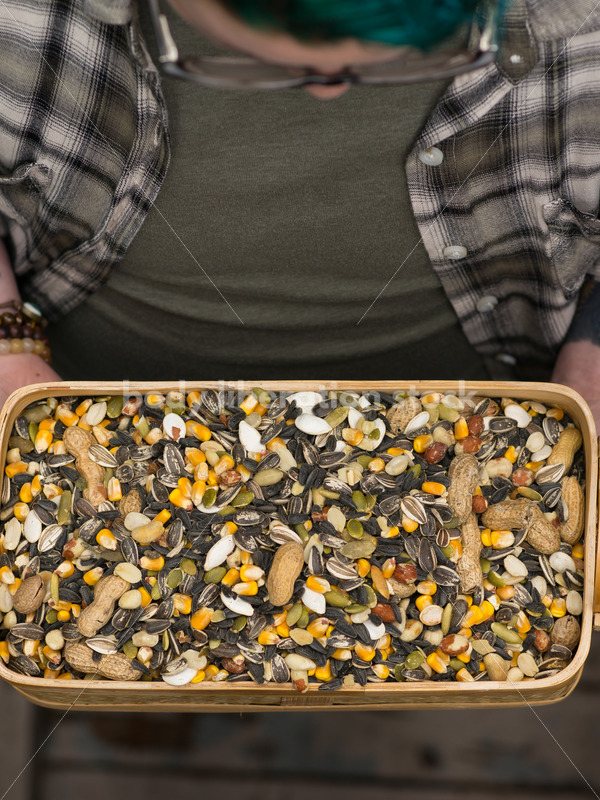 Diverse Gardening Stock Photo: Agender Person Holds Nuts and Seeds - Body Liberation Photos