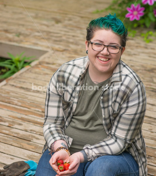 Diverse Gardening Stock Photo: Agender Person Picks Strawberries - Body Liberation Photos