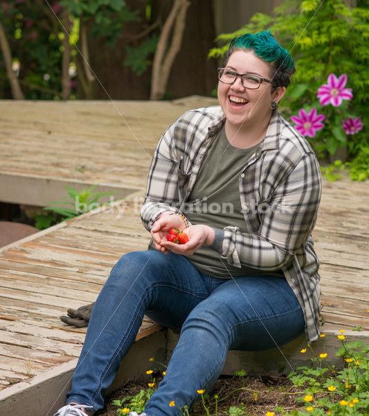 Diverse Gardening Stock Photo: Agender Person Picks Strawberries - Body Liberation Photos