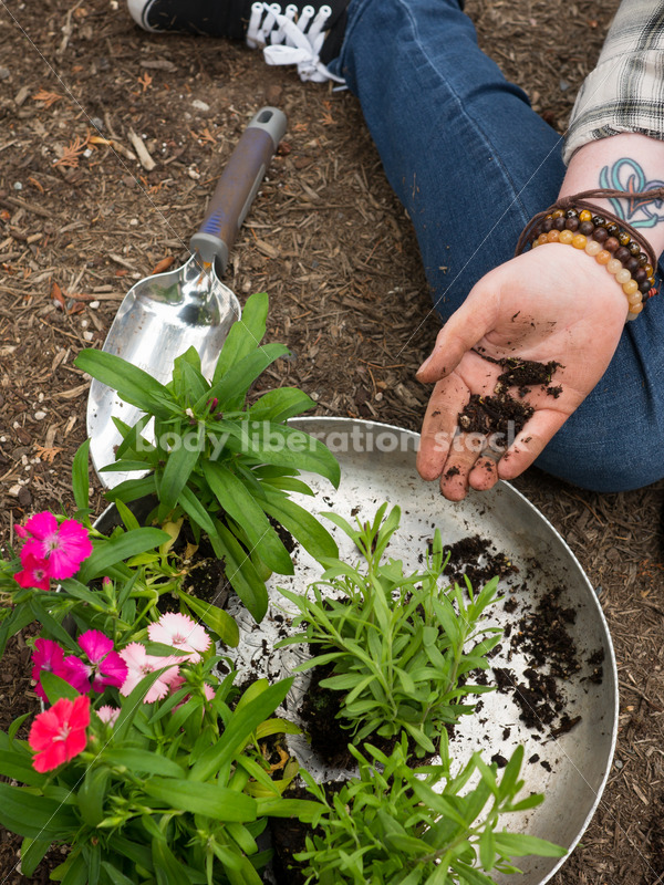 Diverse Gardening Stock Photo: Agender Person Plants Seedling - Body Liberation Photos