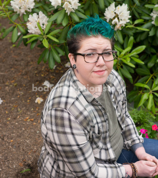 Diverse Gardening Stock Photo: Agender Person Sitting with Trowel - Body Liberation Photos