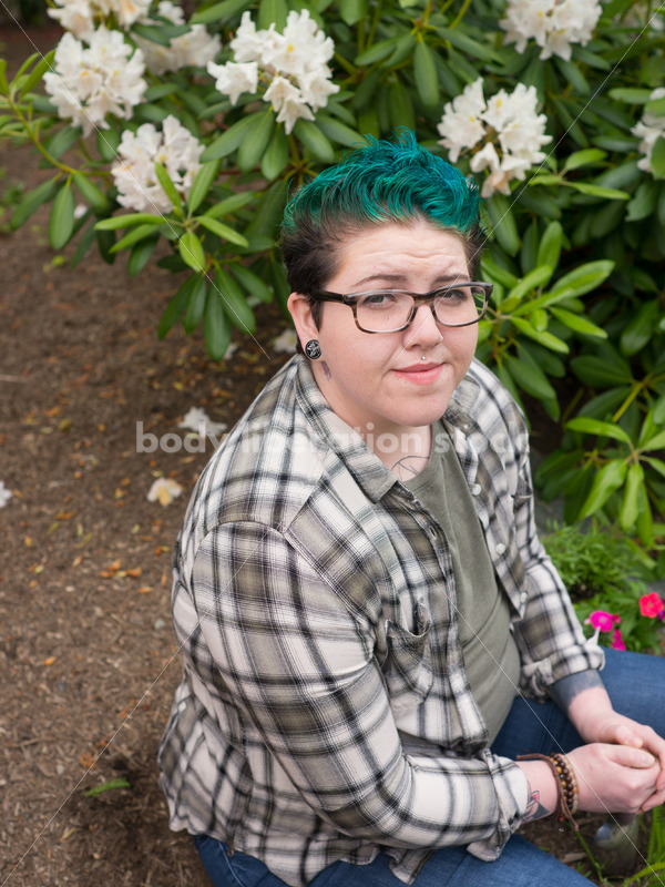 Diverse Gardening Stock Photo: Agender Person Sitting with Trowel - Body Liberation Photos