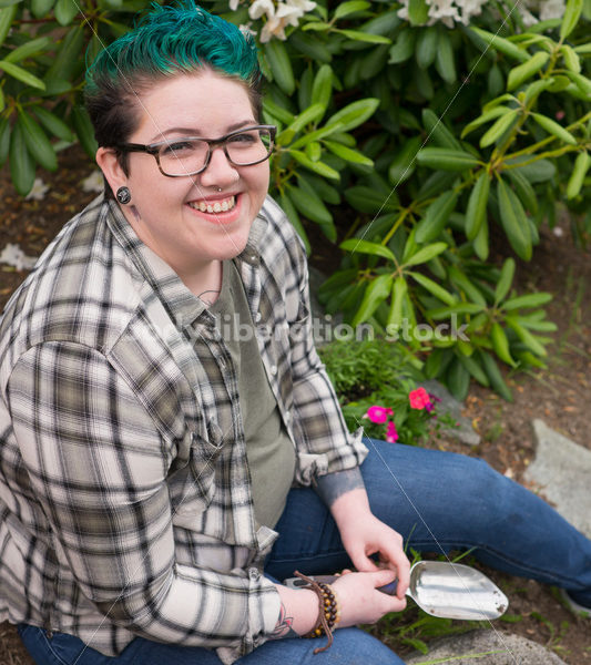 Diverse Gardening Stock Photo: Agender Person Sitting with Trowel - Body Liberation Photos