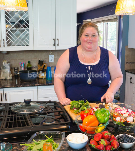 Eating Disorder Recovery Stock Photo: Woman Chopping Peppers on Kitchen Counter - Body Liberation Photos