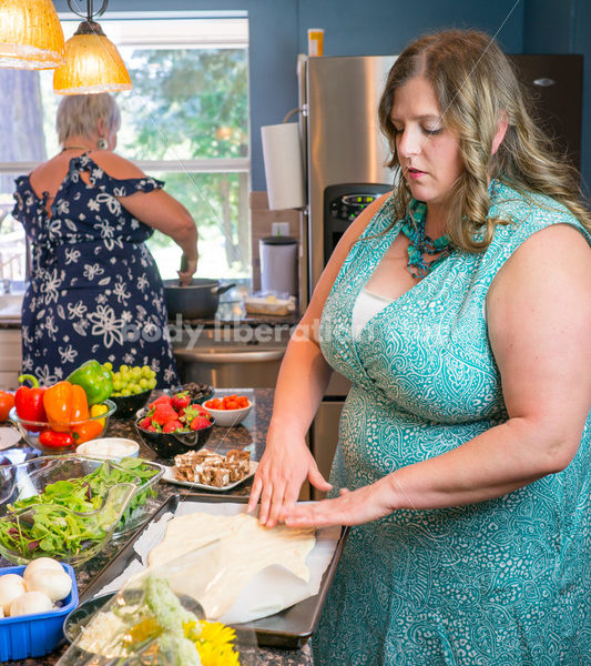 Eating Disorder Recovery Stock Photo: Woman Preparing Pizza Dough in Kitchen - Body Liberation Photos