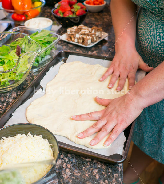 Eating Disorder Recovery Stock Photo: Woman Preparing Pizza Dough in Kitchen - Body Liberation Photos