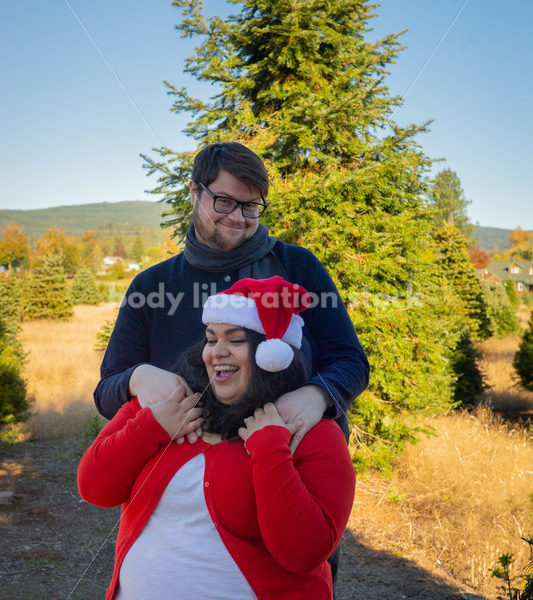 Holiday Stock Image: Plus-Size Couple at a Tree Farm - Body Liberation Photos