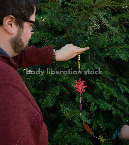 Holiday Stock Image: Plus-Size Couple at a Tree Farm - Body Liberation Photos