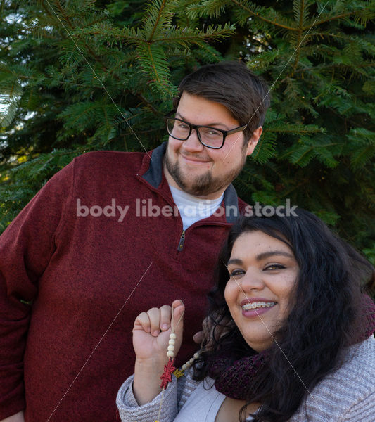 Holiday Stock Image: Plus-Size Couple at a Tree Farm - Body Liberation Photos