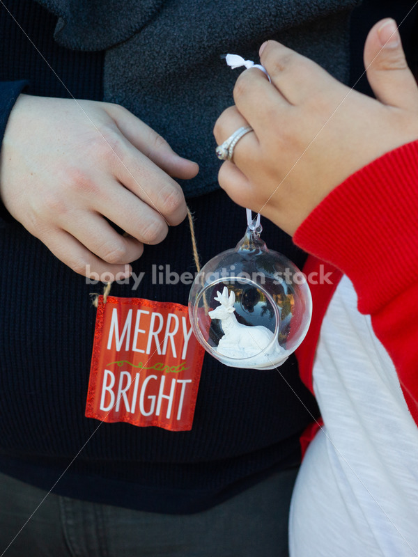 Holiday Stock Image: Plus-Size Couple with Christmas Tree Ornaments - Body Liberation Photos