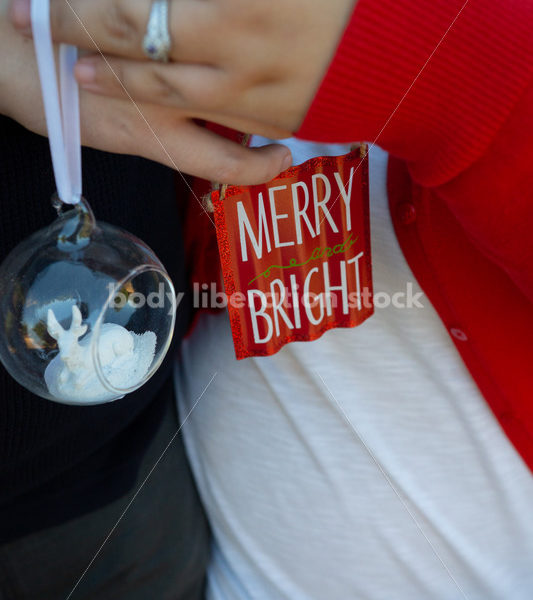 Holiday Stock Image: Plus-Size Couple with Christmas Tree Ornaments - Body Liberation Photos