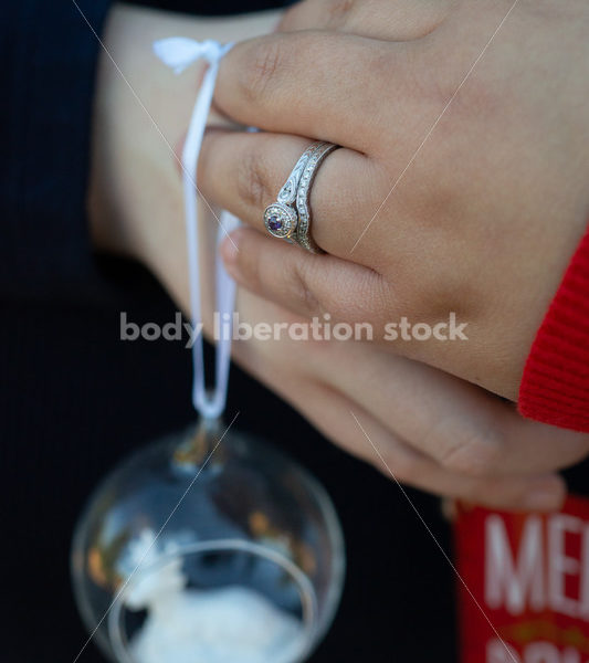 Holiday Stock Image: Plus-Size Couple with Christmas Tree Ornaments - Body Liberation Photos