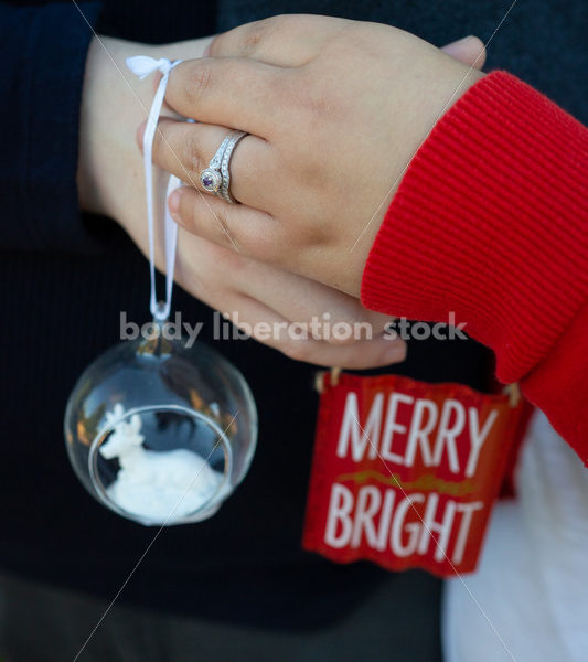 Holiday Stock Image: Plus-Size Couple with Christmas Tree Ornaments - Body Liberation Photos