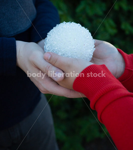 Holiday Stock Image: Plus-Size Couple with Christmas Tree Ornaments - Body Liberation Photos