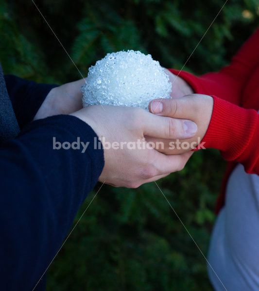 Holiday Stock Image: Plus-Size Couple with Christmas Tree Ornaments - Body Liberation Photos