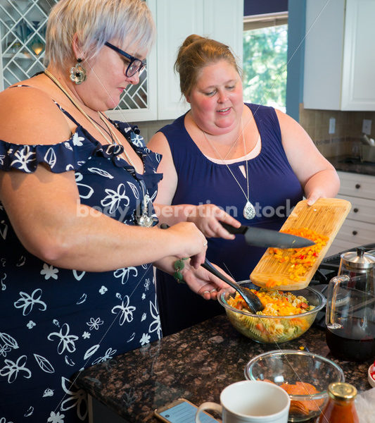 Intuitive Eating Recovery Stock Photo: Women Prepare Pasta Salad in Kitchen - Body Liberation Photos