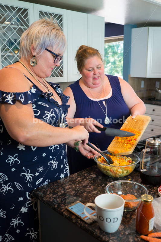 Intuitive Eating Recovery Stock Photo: Women Prepare Pasta Salad in Kitchen - Body Liberation Photos