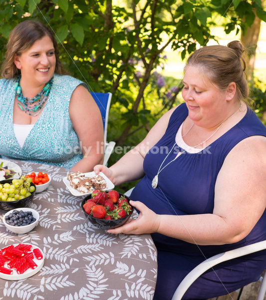 Intuitive Eating Stock Image: Woman Chooses Foods During Outdoor Meal - Body Liberation Photos