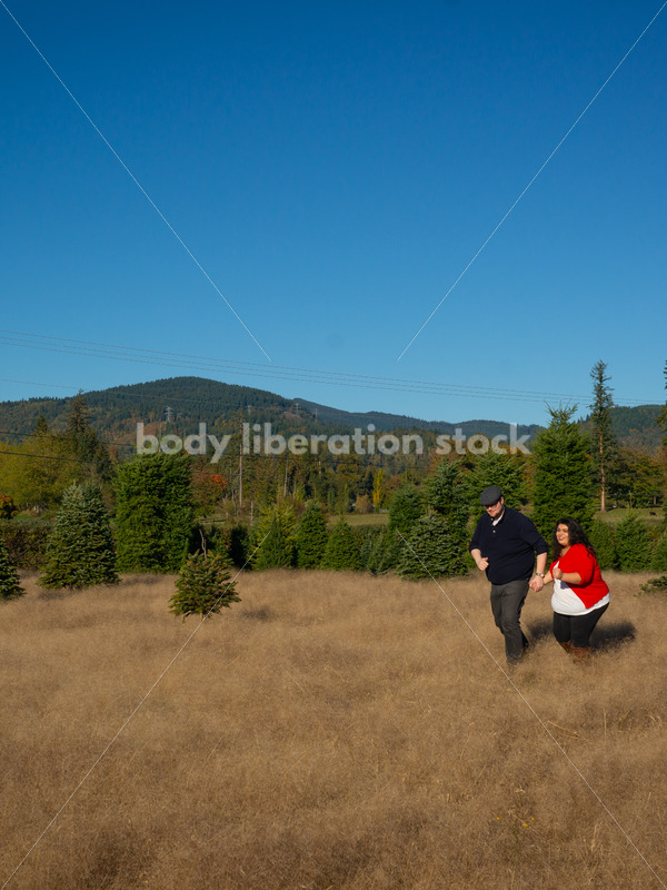 Joyful Movement Stock Image: Couple Running in Field - Body Liberation Photos