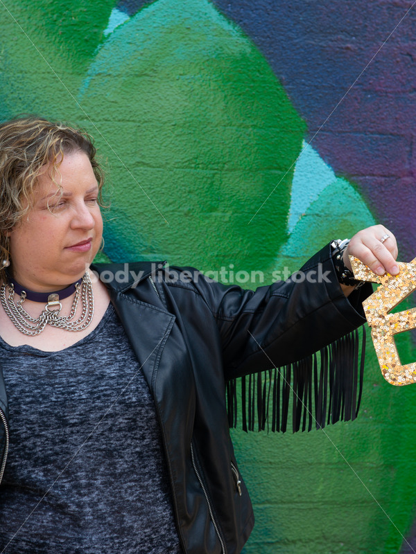 Love, Romance, Valentines Stock Photo: Plus-Size Woman Holding XO Sign - Body Liberation Photos