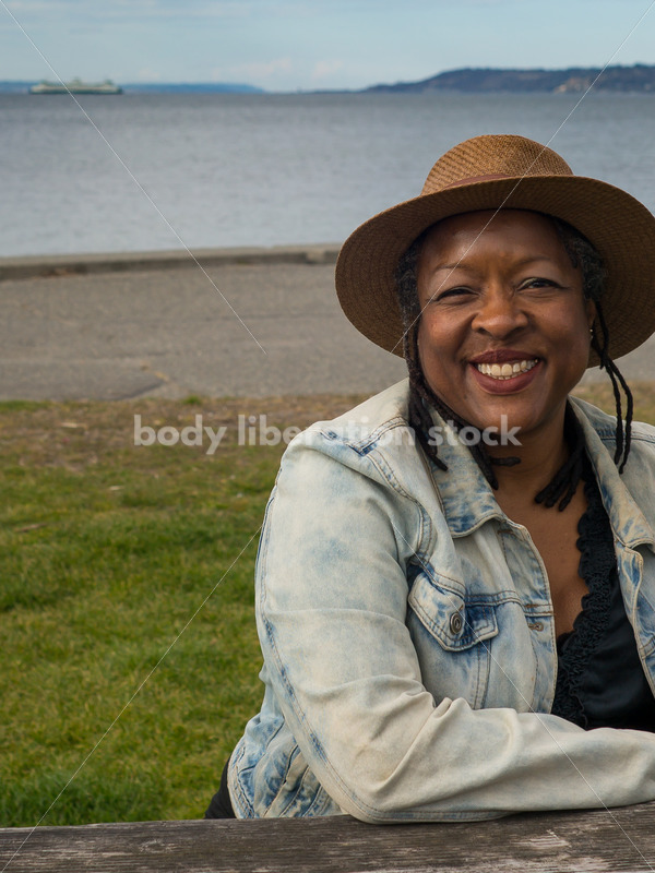 Plus-Size African American Woman Outdoors Relaxing at Picnic Table - Body Liberation Photos