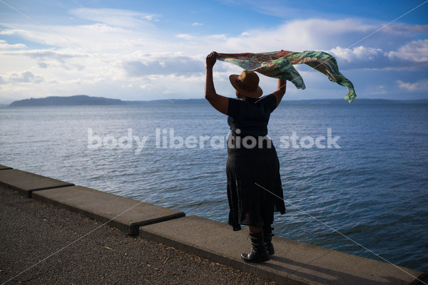 Plus-Size African American Woman Outdoors with Winged Scarf - Body Liberation Photos