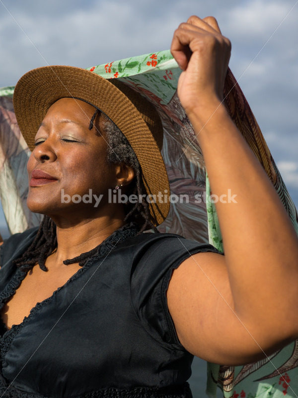 Plus-Size African American Woman Outdoors with Winged Scarf - Body Liberation Photos