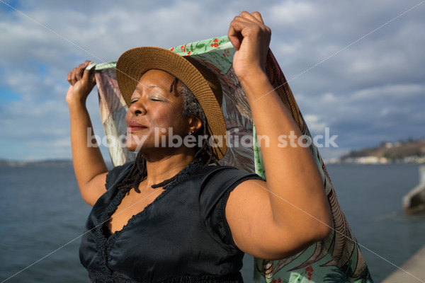 Plus-Size African American Woman Outdoors with Winged Scarf - Body Liberation Photos