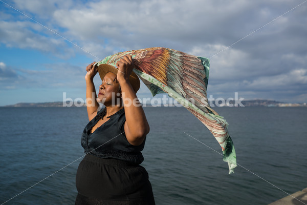 Plus-Size African American Woman Outdoors with Winged Scarf - Body Liberation Photos