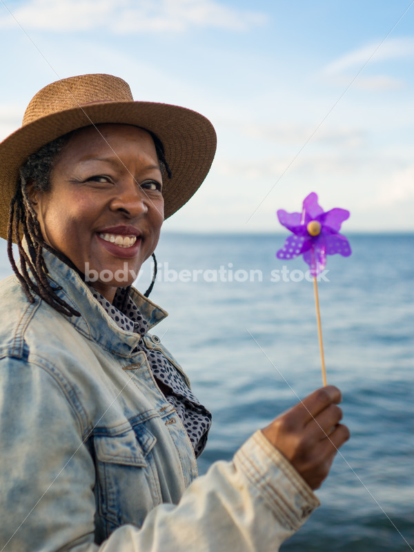 Plus-Size African American Woman with Pinwheel - Body Liberation Photos