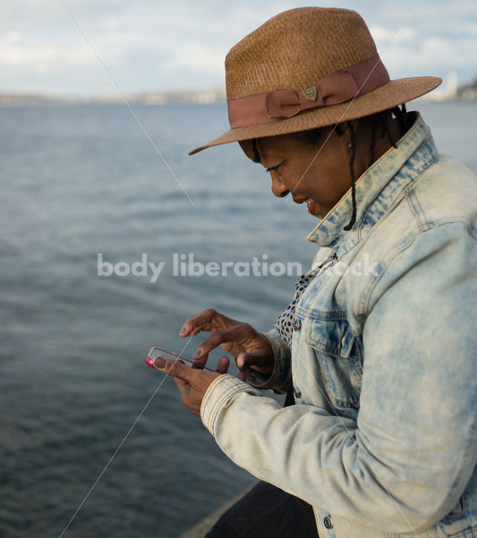 Plus-Size African American Woman with Smartphone - Body Liberation Photos