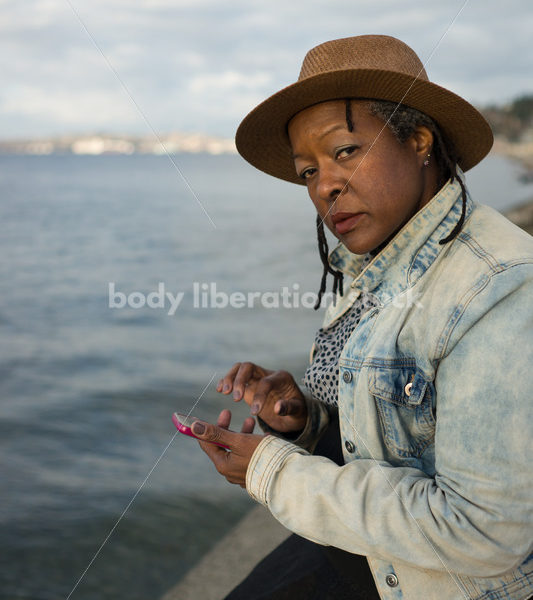 Plus-Size African American Woman with Smartphone - Body Liberation Photos