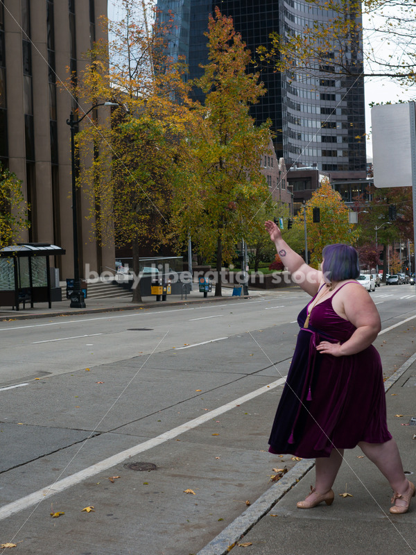 Plus-Size Woman Hails Cab on City Street - Body Liberation Photos