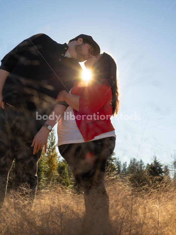 Romance Stock Image: Couple Kissing in Field - Body Liberation Photos