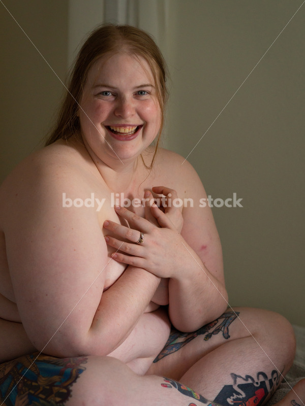Self Care Stock Photo: Plus-Size Woman Laughing in Bed - Body Liberation Photos