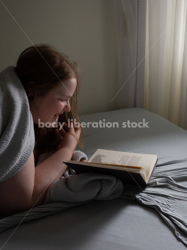 Self Care Stock Photo: Plus-Size Woman Reading in Bed - Body Liberation Photos