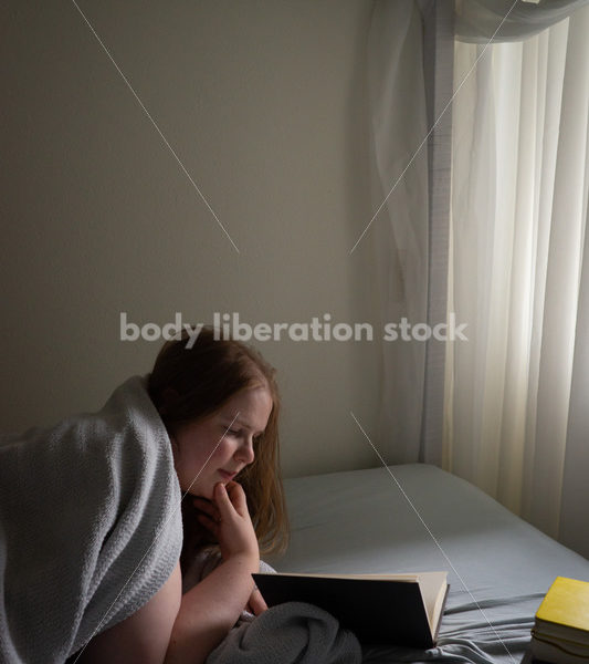 Self Care Stock Photo: Plus-Size Woman Reading in Bed - Body Liberation Photos