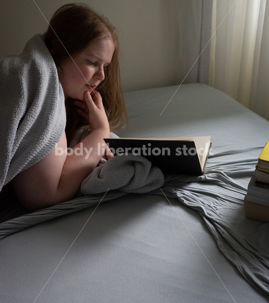 Self Care Stock Photo: Plus-Size Woman Reading in Bed - Body Liberation Photos