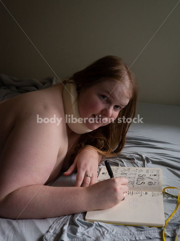 Self Care Stock Photo: Plus-Size Woman Writing and Journaling in Bed - Body Liberation Photos