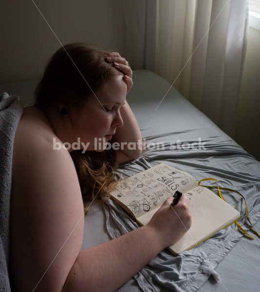 Self Care Stock Photo: Plus-Size Woman Writing and Journaling in Bed - Body Liberation Photos