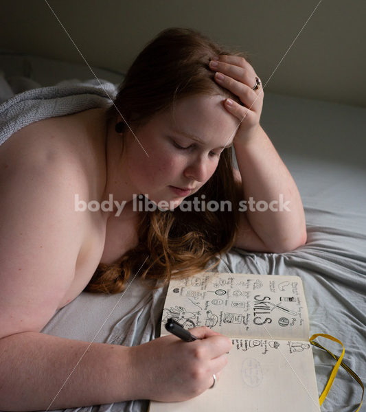 Self Care Stock Photo: Plus-Size Woman Writing and Journaling in Bed - Body Liberation Photos