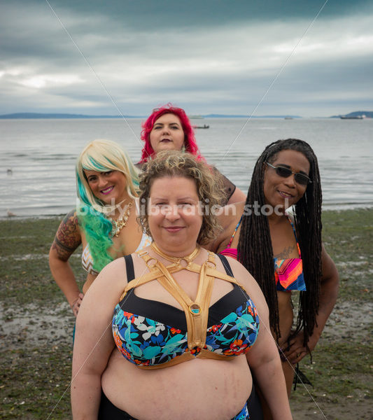 Stock Image: Group of friends walking on beach - Body Liberation Photos & Stock