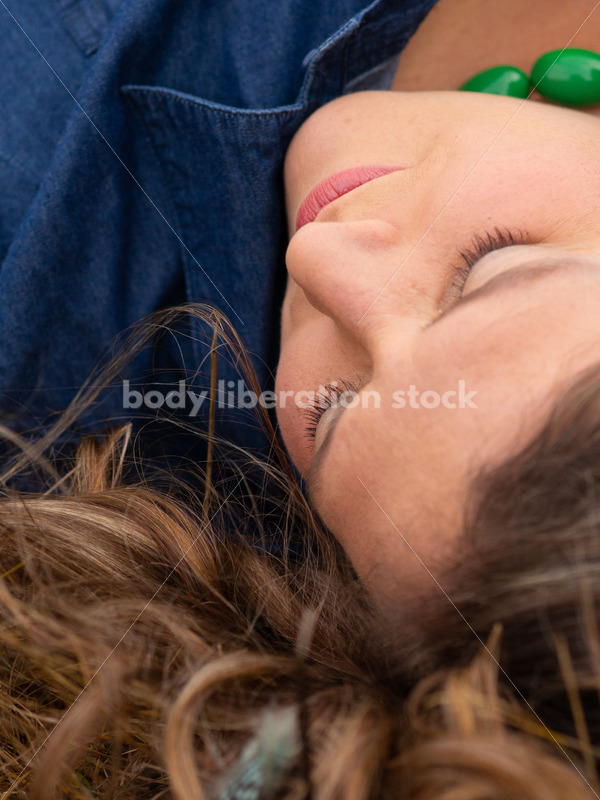 Stock Image: Plus-Size Woman with Feathers in Grass - Body Liberation Photos