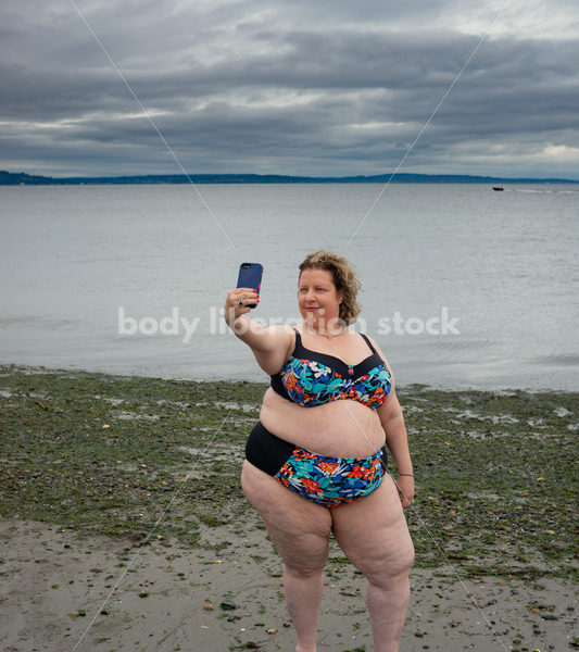 Technology Stock Image: Smartphone on the Beach - Body Liberation Photos