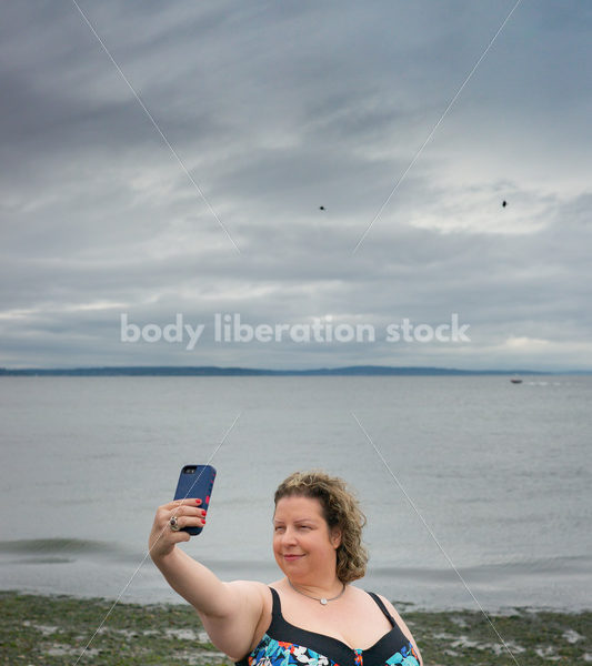 Technology Stock Image: Smartphone on the Beach - Body Liberation Photos