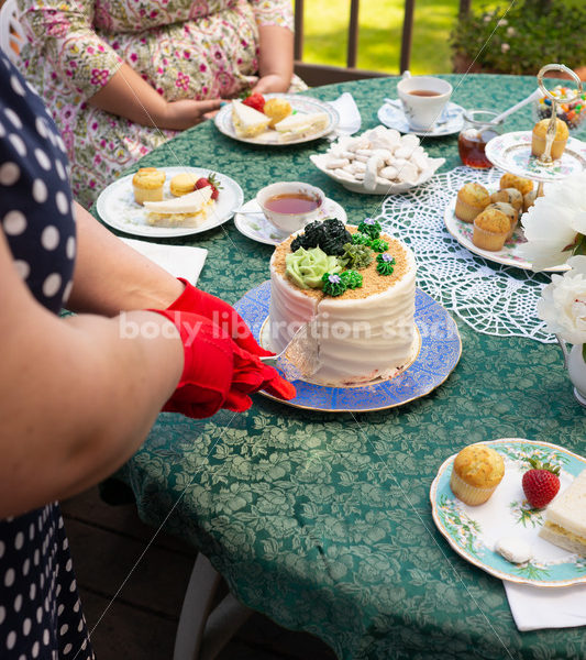 Woman Cuts Cake at Tea Party - Body Liberation Photos