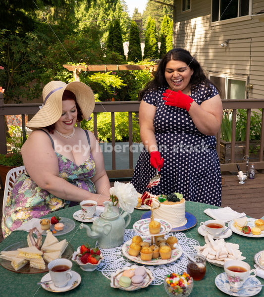 Woman Cuts Cake at Tea Party - Body Liberation Photos