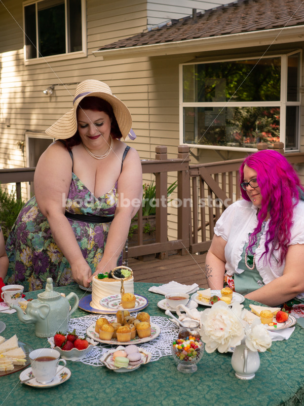 Woman Cuts Cake at Tea Party - Body Liberation Photos